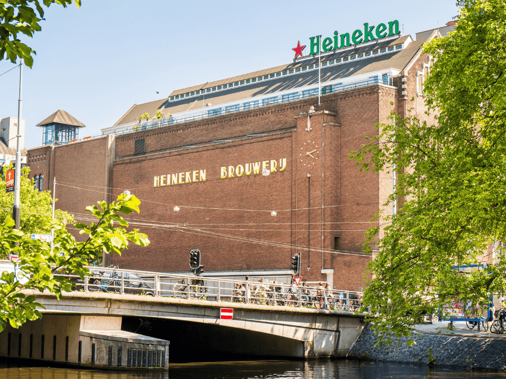 A view of the Heineken Brewery in Amsterdam from across a canal.