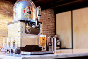A BLADE beer machine with a Birra Moretti Tap Handle, a Birra Moretti beer keg, a fresh glass of Birra Moretti on the drip tray and three empty Birra Moretti glasses.