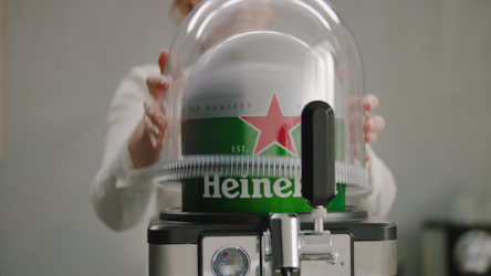 A girl putting the dome on a BLADE beer machine