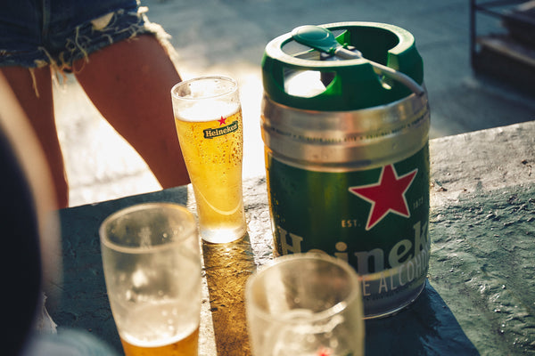 Heineken glass and Heineken 5L keg in the sun