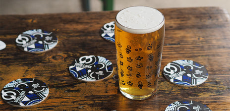 Beer in a beer glass with Magic Lager coasters