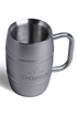 A stainless steel mug with the Heineken logo on it.