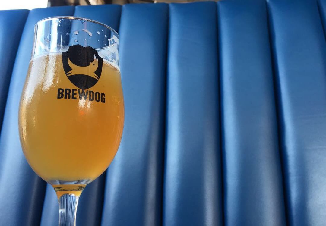 A BrewDog beer being enjoyed at a pub in Leeds, with the brewery's distinctive branding visible.