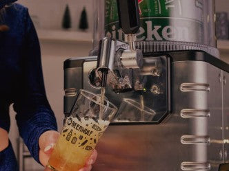 Pouring a glass of Heineken beer from a BLADE beer machine into a Beerwulf beer glass.