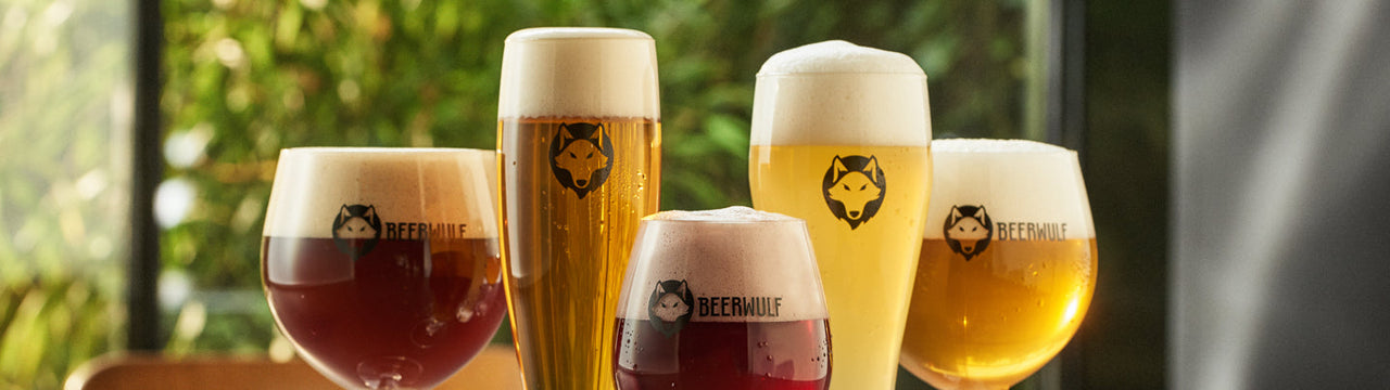 Five different Beerwulf beer glasses filled with various styles of beer.